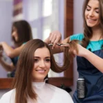 Women's haircut session focused on precise trimming, smooth layering and balanced shaping by skilled stylist