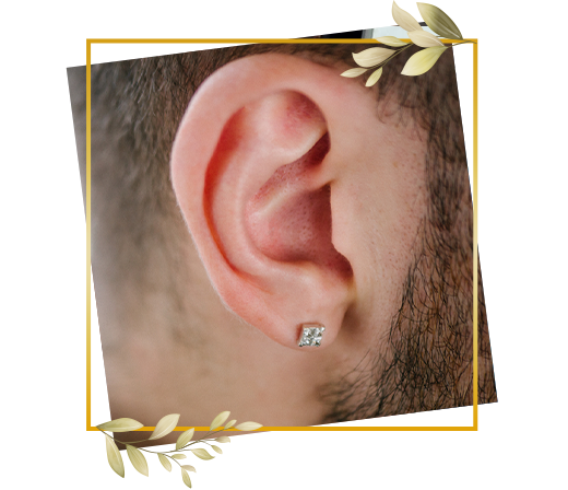 Men's ear styled with subtle stud piercing highlighting clean placement and modern grooming choice